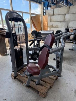 a gym equipment sitting on a pallet in a building