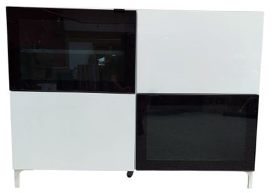 a black and white cabinet with a mirror on top of it