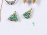three pieces of jewelry sitting on top of a table next to each other