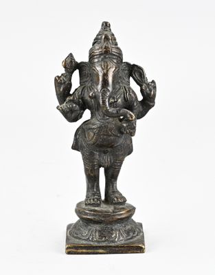 statue of an elephant holding a bird on a pedestal
