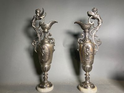 pair of antique silver vases with birds and flowers on them