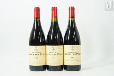 three bottles of red wine sitting next to each other on a white surface