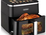 a close up of an air fryer with chicken in it