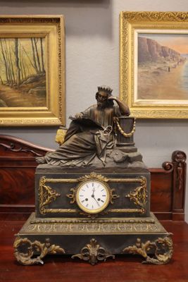 a clock that is sitting on a table in a room