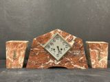 an image of a clock sitting on top of a table next to two vases