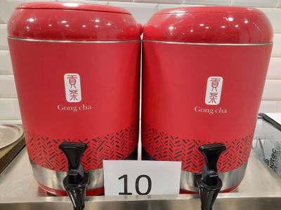 two red containers that are sitting on a counter