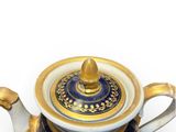 a blue and gold teapot with a gold lid