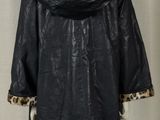 an image of a black coat with a leopard print lining