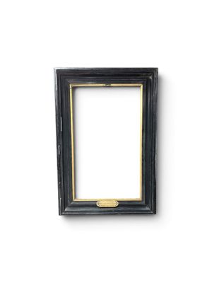 a black picture frame on a white wall with a white background