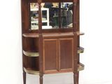 a wooden cabinet with a mirror on top of it