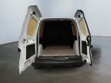 a white van with its doors open in a room