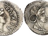 a silver coin with an image of a woman on it
