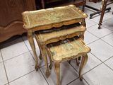 three tables that are stacked on top of each other