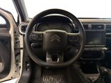 the interior of a car with a steering wheel and dashboard controls