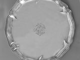 a silver plate with a floral design on the rim