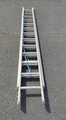 a ladder that is sitting in the middle of a parking lot