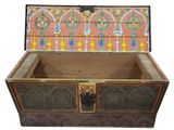 a wooden chest with a decorative design on it