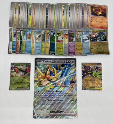 gros plan d'une collection de cartes pokemon sur une table