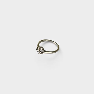 a close up of a silver ring with a small star on it
