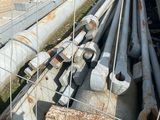 a lot of pipes that are sitting in the dirt