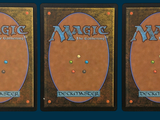 three decks of magic the gathering are shown on a blue background