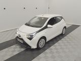 a picture of a small white car in a garage