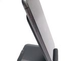 a cell phone that is sitting on top of a stand