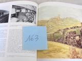 un livre ouvert sur lequel figure l'image d'un train