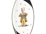 un gros plan d'une planche de surf sur laquelle est représenté un clown