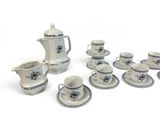 a lot of cups and saucers that are sitting on a table