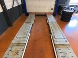 two metal benches in the middle of a room