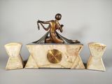 a statue of a woman sitting on top of a table