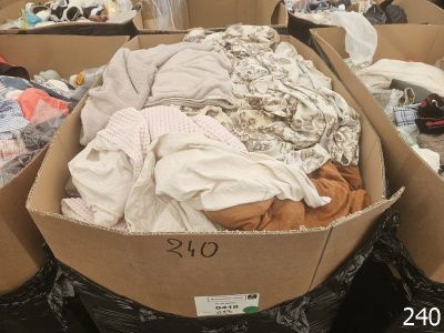 many boxes of clothes that are sitting in a store