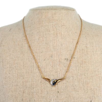 a close up of a mannequin torso with a necklace on it