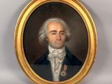 portrait d'un homme en costume-cravate dans un cadre doré