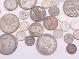 a lot of coins that are on the table