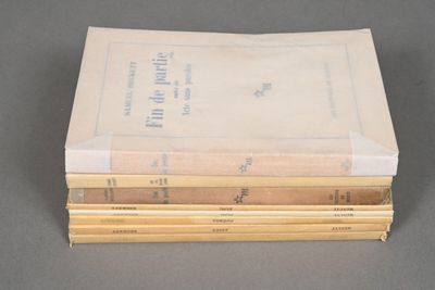 several books stacked on top of each other on a table