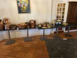 many pots and pans on a table in a room