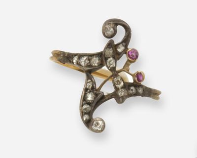 une photo d'une broche en forme d'étoile de mer en or et diamants