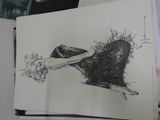 a black and white drawing of a woman sitting on a chair
