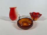 two vases and a glass vase on a table