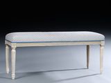 a white bench with a blue stripe on it