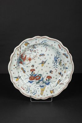 a white and blue plate with a floral design on it
