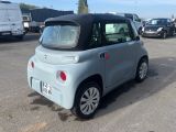 a small car that is parked in a parking lot