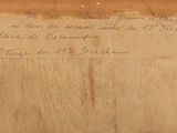 an old piece of paper with writing on it sitting on a table