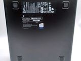 the back of a laptop with a battery on top of it