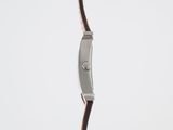 a close up of a wrist watch with a brown leather strap