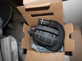 a box with a grenade inside of it on the floor