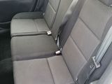 the back seats of a car are empty with no one in it