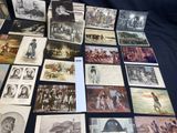 a lot of old photos of people on the table